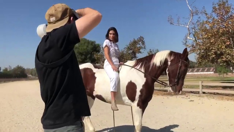 Carolina Levi posing with horses Four Legs On Set in